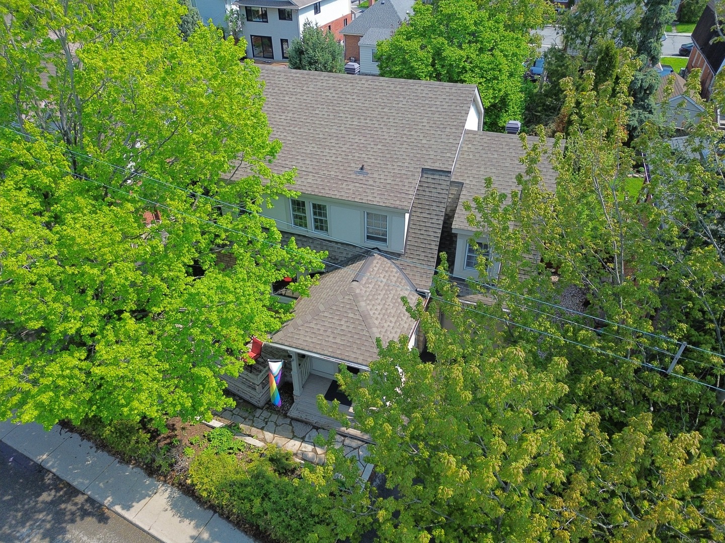 Aerial of a home framed by trees